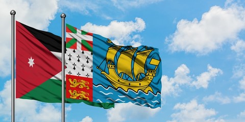 Jordan and Saint Pierre And Miquelon flag waving in the wind against white cloudy blue sky together. Diplomacy concept, international relations.