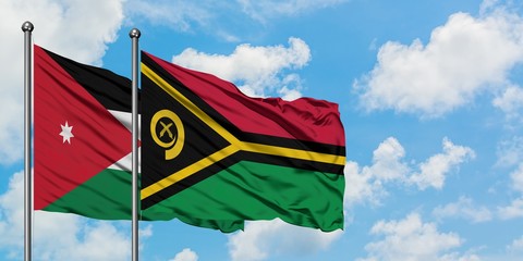 Jordan and Vanuatu flag waving in the wind against white cloudy blue sky together. Diplomacy concept, international relations.
