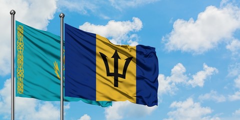 Kazakhstan and Barbados flag waving in the wind against white cloudy blue sky together. Diplomacy concept, international relations.