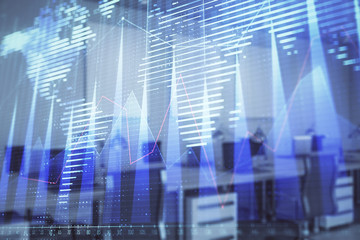 Stock and bond market graph and world map with trading desk bank office interior on background. Multi exposure. Concept of international finance