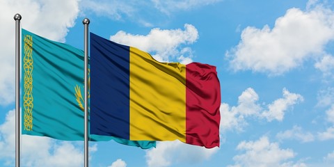 Kazakhstan and Chad flag waving in the wind against white cloudy blue sky together. Diplomacy concept, international relations.