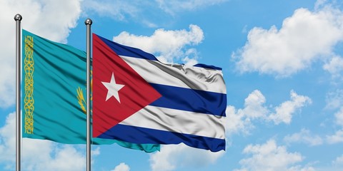 Kazakhstan and Cuba flag waving in the wind against white cloudy blue sky together. Diplomacy concept, international relations.
