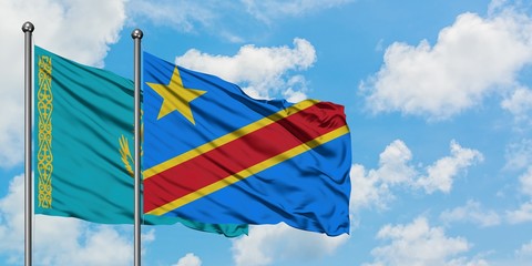 Kazakhstan and Congo flag waving in the wind against white cloudy blue sky together. Diplomacy concept, international relations.