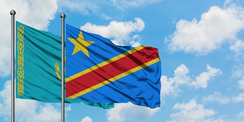 Kazakhstan and Congo flag waving in the wind against white cloudy blue sky together. Diplomacy concept, international relations.