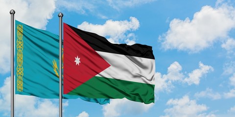 Kazakhstan and Jordan flag waving in the wind against white cloudy blue sky together. Diplomacy concept, international relations.