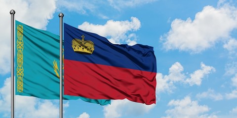 Kazakhstan and Liechtenstein flag waving in the wind against white cloudy blue sky together. Diplomacy concept, international relations.