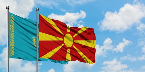 Kazakhstan and Macedonia flag waving in the wind against white cloudy blue sky together. Diplomacy concept, international relations.