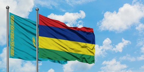 Kazakhstan and Mauritius flag waving in the wind against white cloudy blue sky together. Diplomacy concept, international relations.