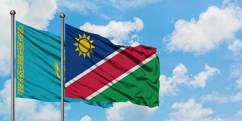 Kazakhstan and Namibia flag waving in the wind against white cloudy blue sky together. Diplomacy concept, international relations.