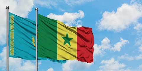 Kazakhstan and Senegal flag waving in the wind against white cloudy blue sky together. Diplomacy concept, international relations.
