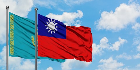 Kazakhstan and Taiwan flag waving in the wind against white cloudy blue sky together. Diplomacy concept, international relations.