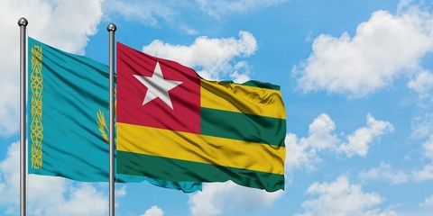 Kazakhstan and Togo flag waving in the wind against white cloudy blue sky together. Diplomacy concept, international relations.