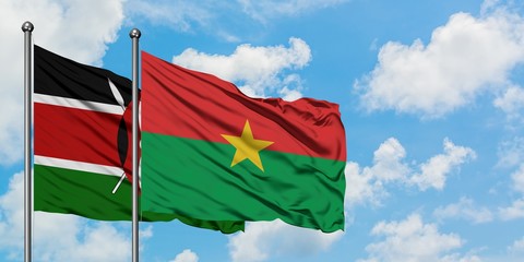 Kenya and Burkina Faso flag waving in the wind against white cloudy blue sky together. Diplomacy concept, international relations.