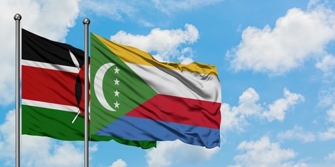 Kenya and Comoros flag waving in the wind against white cloudy blue sky together. Diplomacy...