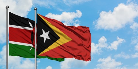 Kenya and East Timor flag waving in the wind against white cloudy blue sky together. Diplomacy concept, international relations.