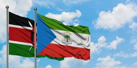 Kenya and Equatorial Guinea flag waving in the wind against white cloudy blue sky together. Diplomacy concept, international relations.