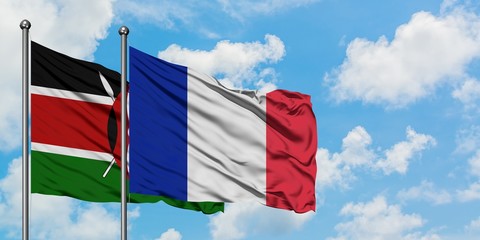Kenya and France flag waving in the wind against white cloudy blue sky together. Diplomacy concept, international relations.