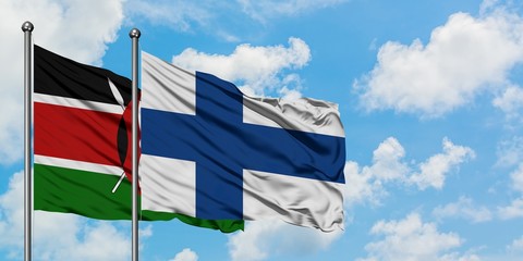 Kenya and Finland flag waving in the wind against white cloudy blue sky together. Diplomacy concept, international relations.