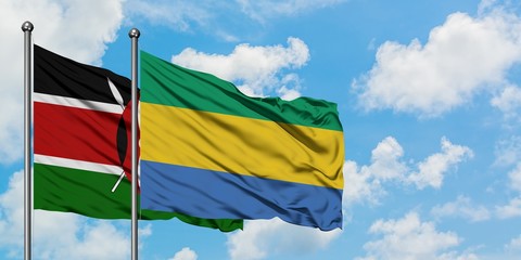 Kenya and Gabon flag waving in the wind against white cloudy blue sky together. Diplomacy concept, international relations.