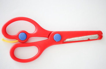 Red handle scissors placed on a white background - Image