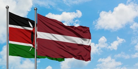 Kenya and Latvia flag waving in the wind against white cloudy blue sky together. Diplomacy concept, international relations.