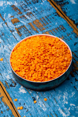 Source of proteins, vegetarian food, red lentils legumes close up