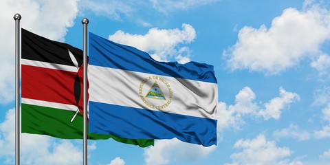 Kenya and Nicaragua flag waving in the wind against white cloudy blue sky together. Diplomacy concept, international relations.