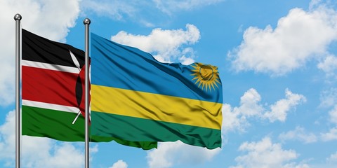 Kenya and Rwanda flag waving in the wind against white cloudy blue sky together. Diplomacy concept, international relations.