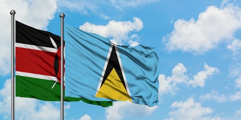 Kenya and Saint Lucia flag waving in the wind against white cloudy blue sky together. Diplomacy concept, international relations.