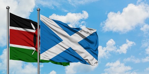 Kenya and Scotland flag waving in the wind against white cloudy blue sky together. Diplomacy concept, international relations.