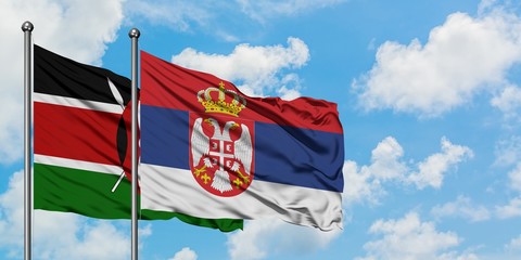 Kenya and Serbia flag waving in the wind against white cloudy blue sky together. Diplomacy concept, international relations.