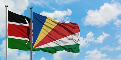 Kenya and Seychelles flag waving in the wind against white cloudy blue sky together. Diplomacy concept, international relations.