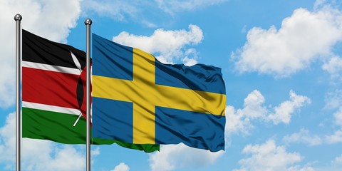 Kenya and Sweden flag waving in the wind against white cloudy blue sky together. Diplomacy concept, international relations.