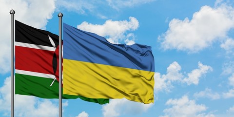 Kenya and Ukraine flag waving in the wind against white cloudy blue sky together. Diplomacy concept, international relations.