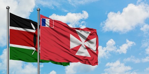 Kenya and Wallis And Futuna flag waving in the wind against white cloudy blue sky together. Diplomacy concept, international relations.