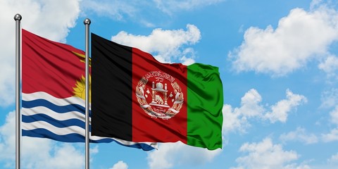 Kiribati and Afghanistan flag waving in the wind against white cloudy blue sky together. Diplomacy concept, international relations.