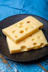 Two blocks of French emmental semi-hard cheese