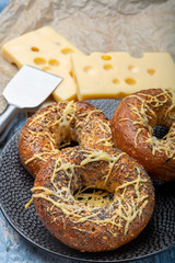 Tasty baked bagels with melted french emmental cheese