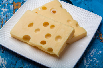 Two blocks of French emmental semi-hard cheese