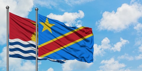 Kiribati and Congo flag waving in the wind against white cloudy blue sky together. Diplomacy concept, international relations.