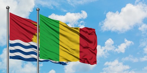 Kiribati and Mali flag waving in the wind against white cloudy blue sky together. Diplomacy concept, international relations.