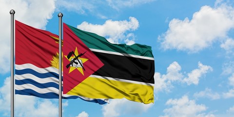 Kiribati and Mozambique flag waving in the wind against white cloudy blue sky together. Diplomacy concept, international relations.