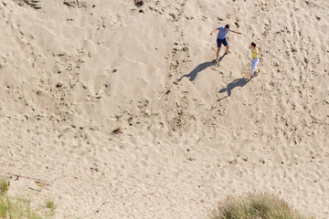 Parnidis dune in Nida. The Curonian Spit. Sand and Grass. People Walking On the Sand Dunes Images....