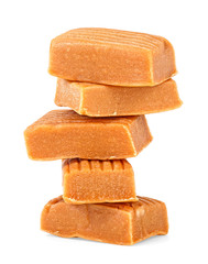 Soft caramel candies isolated on a white background
