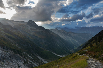 Fototapeta premium Wonderful views of the mountains in the Swiss Alps with backpackers. 