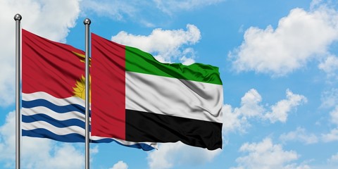 Kiribati and United Arab Emirates flag waving in the wind against white cloudy blue sky together. Diplomacy concept, international relations.