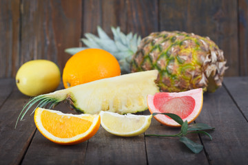 Slices of pineapple, orange, grapefruit and lemon. Citrus fruit for healthy life.
