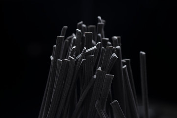 Italian spaghetti close-up shooting.Background texture.black spaghetti.