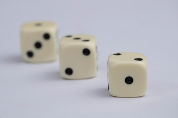White dice with black dots in white background