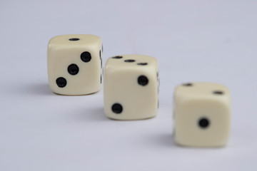 White dice with black dots in white background